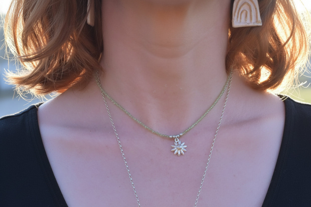 Peridot and silver flower charm necklace